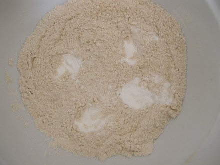 Preheat oven to 375 degrees F.  In a large bowl, add all of the dry ingredients.  One trick I learned while working a baker's shift through graduate school, was to add each teaspoon of (salt/powder/soda) in separate heaps and whisk with each new ingredient.  As a mom, as in a busy restaurant kitchen, it's easy to get distracted and forget whether or not you paused in between that first and second teaspoon or third and fourth teaspoon of baking powder.  Tip= Priceless!