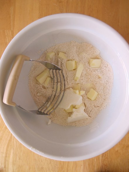 Cut your butter into the flower until it resembles the peas.  Pastry cutter is a tool of the trade.  It's worth it's weight in gold if you've ever tried to use two butter knives or a fork to cut butter into your dry ingredients.