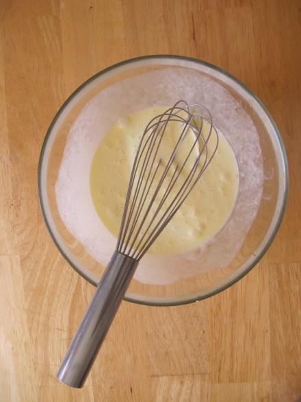 Beat cream and eggs with a whisk..  I sometimes like to add a pinch of paprika.