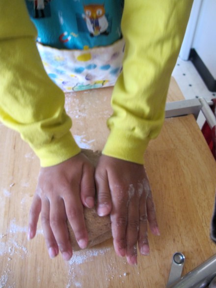 Put those little hands to work and then bring out the "big guns" and knead until your dough is smooth and elastic-- should not be sticky.