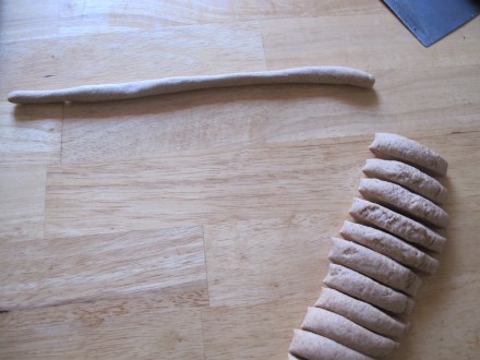 Once risen, punch, knead a bit more and then section your your dough.  Your little one will love making the "snakes" for this one.