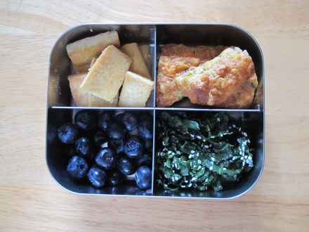 Kale sesame salad, pan fried tofu bites, cheddar dill scone (place on a bed of two bacon halves if kiddo needs a little extra), and blueberries-- get them while they're still in season.  
