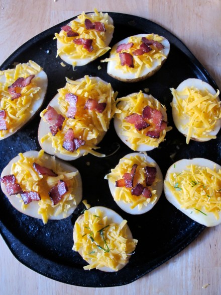 If you're going for the kill (sorry, I couldn't resist), top your potatoes with those prepared bacon slices).  Place it in the 350 degree F oven for 30 minutes.