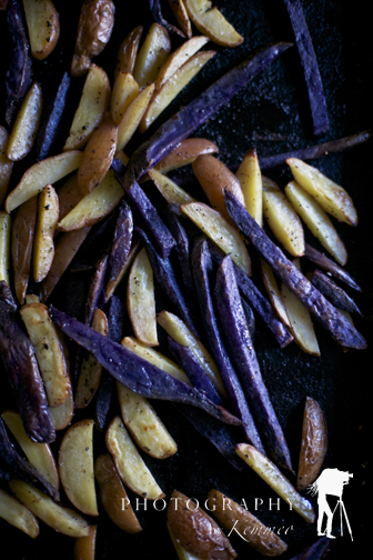 Lay it on a cookie sheet and place in a 350 degree F oven.  Bake for 30 minutes or until potatoes soften.  Longer if you like crispier, browner potatoes.